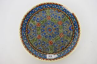 A Middle Eastern earthenware charger wit