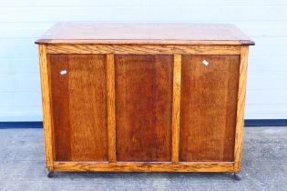 An oak blanket chest with three panel fr