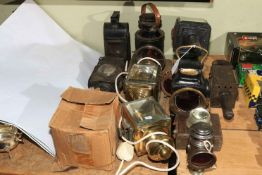 Collection of vintage and modern lamps including lanterns, railway lamps, car lamps,