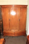 Edwardian mahogany triple door bow front wardrobe, 208cm by 161cm by 56cm.