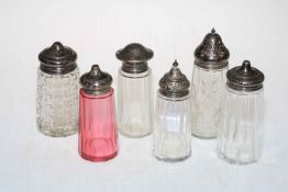 Collection of six silver topped sugar casters.