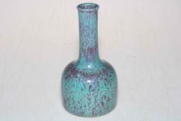 Chinese bottle neck vase decorated with green and purple mottled glaze with impressed mark to base,