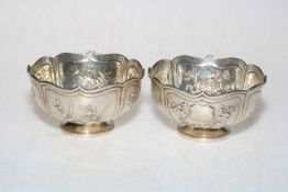 Pair Chinese silver bowls with panels of embossed foliage and serpentine rims, marks to foot rim, 9.