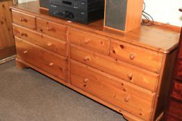 Ducal pine low eight-drawer chest, 62cm by 169cm by 45cm.