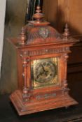 Vintage ornate oak mantel clock with gilt metal dial, 45cm high.