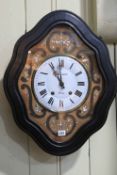 Continental ebonised and mother of pearl inlaid wall clock.