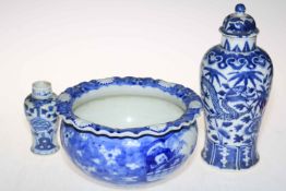 Oriental blue and white bowl, lidded vase and small vase.