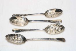 Collection of four George III silver berry spoons