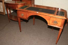 Modern bow backed two drawer writing desk having pull out stationery trays and pair hidden