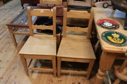 Set of four light elm kitchen chairs.