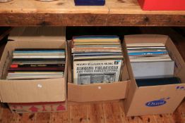 Three boxes of LP records.