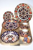 Collection of Royal Crown Derby including plates, bowls, two cups and saucers, snake paperweight.