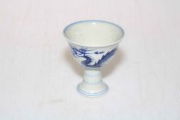 Chinese blue and white stem cup decorated with dragons, six-character marks to base.