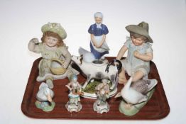 Pair of bisque child figures, Royal Copenhagen girl with goose and two others,