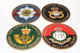 Four cast iron military interest plaques.
