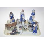 Eight Royal Copenhagen figures including boy with cow, girl with cow, goose girls etc.
