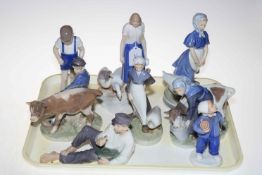 Eight Royal Copenhagen figures including boy with cow, girl with cow, goose girls etc.