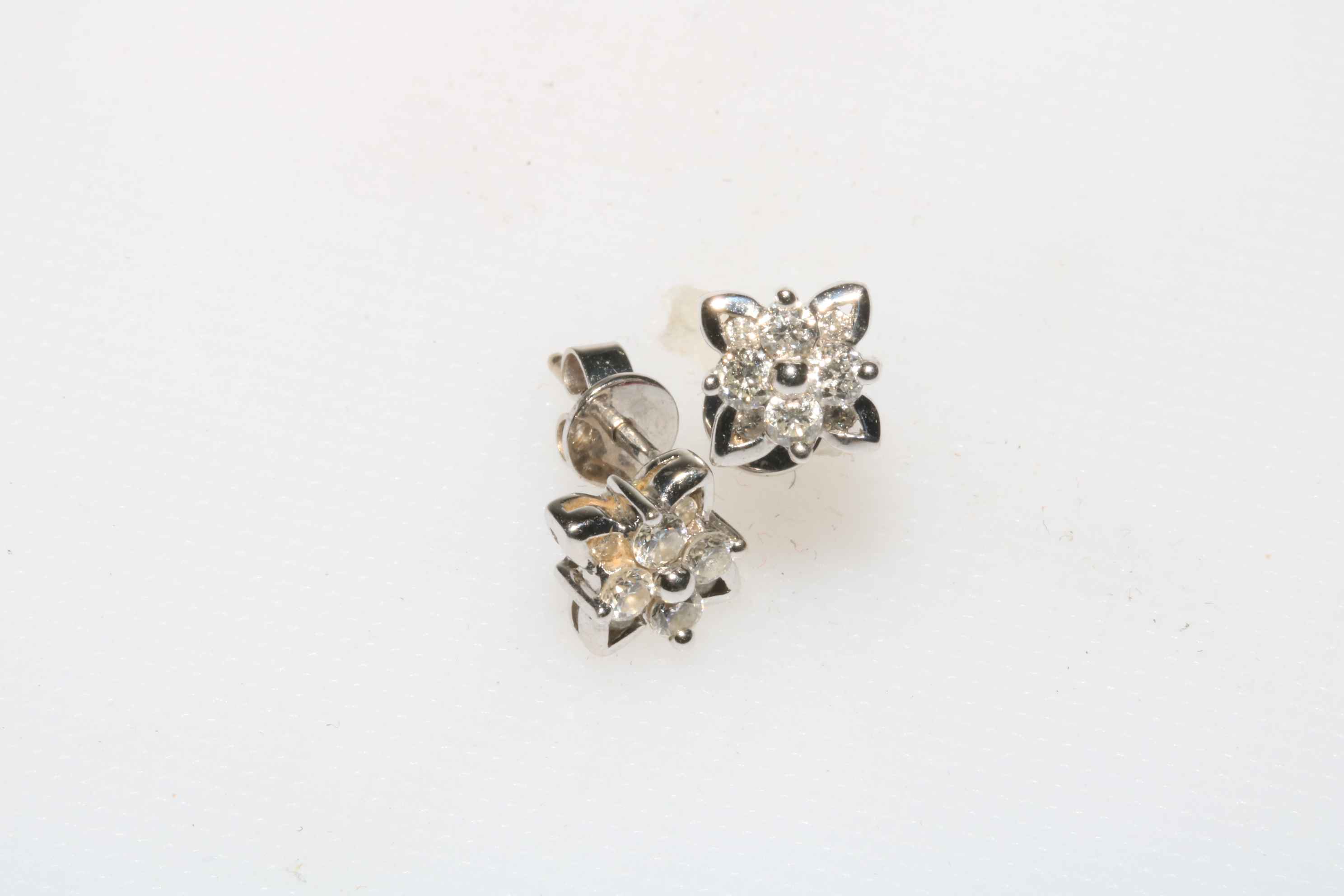 18 carat white gold diamond cluster earrings.