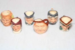 Six miniature Royal Doulton toby jugs, 9cm high.