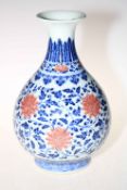 Large Chinese ovoid vase decorated with red flowers on blue and white ground with six-character