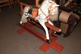 Sponge painted rocking horse on stained wood safety stand, 96cm by 153cm.
