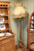 Gilt painted triform standard lamp and shade.