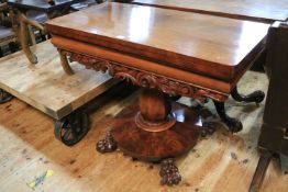 Victorian mahogany fold top tea table on vase shaped pedestal to four paw feet, 73cm by 95.