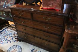 George III mahogany chest of two short above three long graduated drawers on ogee bracket feet,