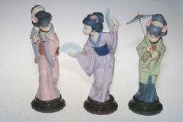 Three Lladro Geisha figures.
