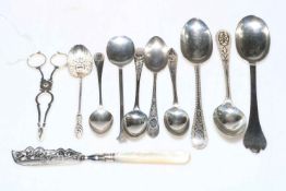 Collection of silver spoons, together with butter knife and sugar nips.
