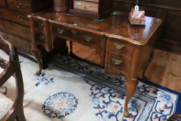 Early 20th Century mahogany five drawer shaped front dressing/writing table on cabriole legs,