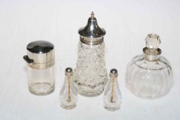 Silver topped caster, two silver mounted toilet bottles and two small scent bottles (5).
