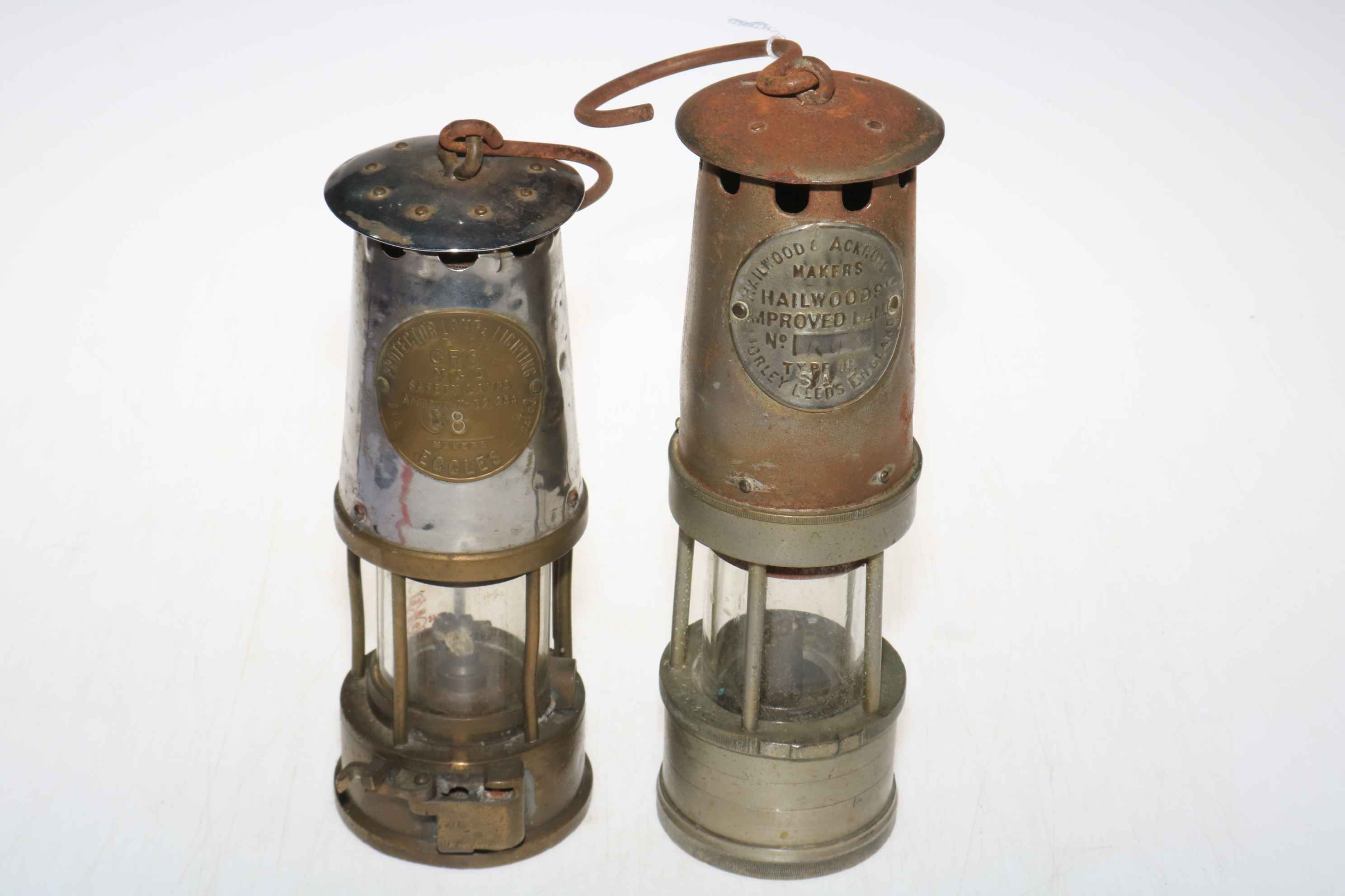 Two miners lamps by Protector Lamp Co.