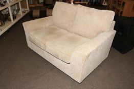 Two seater settee in oatmeal fabric.