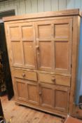 Victorian pine housemaids cupboard having four panelled doors divided by two drawers, 187.