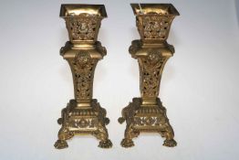 Large pair of ornate pierced brass vases decorated with masks and flora,