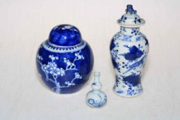 Small Chinese prunus ginger jar, lidded blue and white vase and miniature double gourd vase.