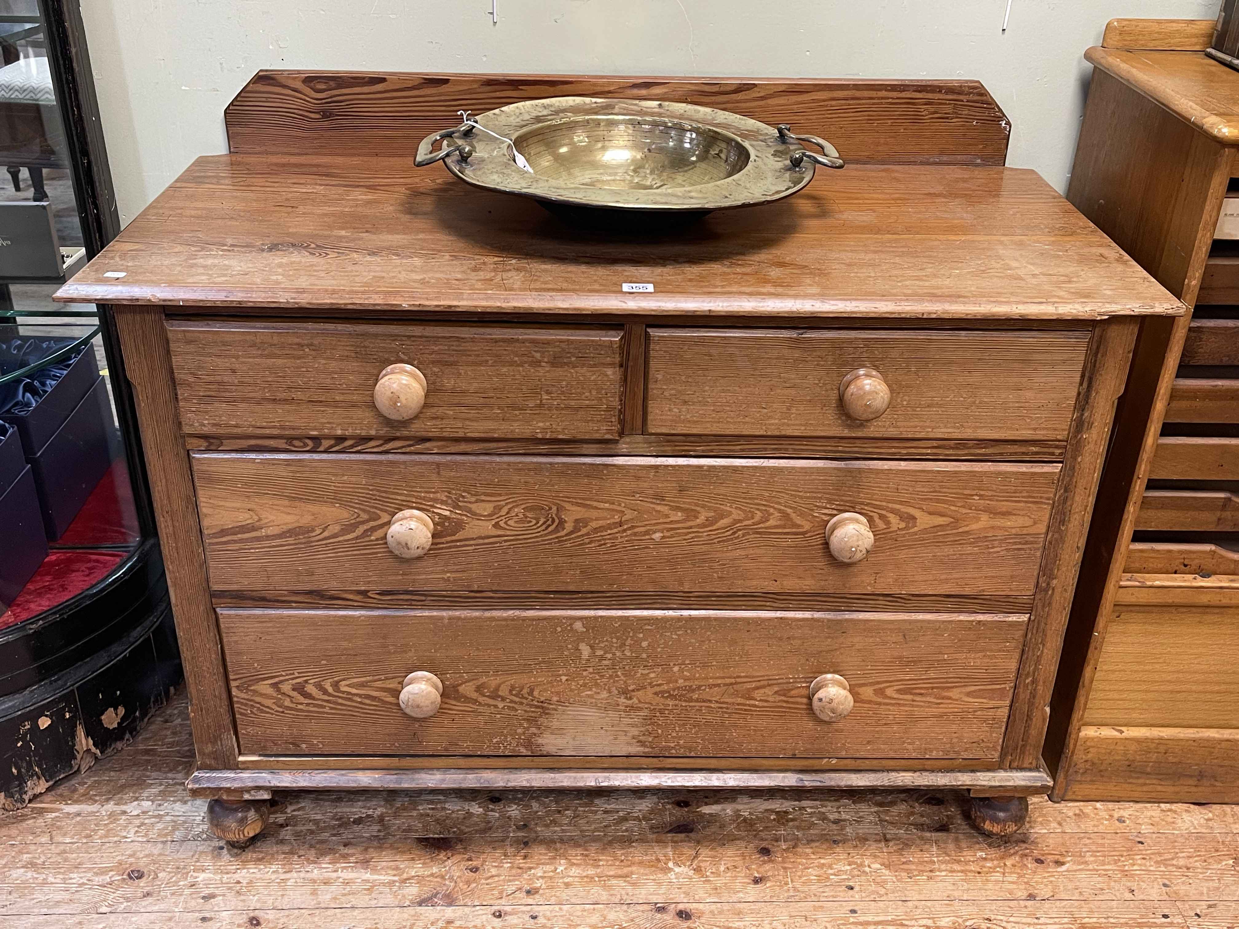 Victorian pitch pine chest of two short above two long drawers on turned legs,