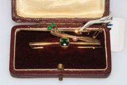 15 carat gold green stone bar brooch and two 9 carat gold bar brooches (3).
