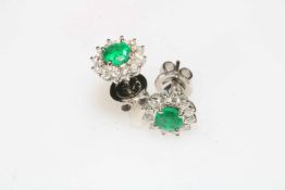 Pair of 18 carat white gold, emerald and diamond earrings, emerald approx 1.