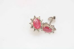 Pair of 18 carat white gold, ruby and diamond cluster earrings, ruby approx 1.
