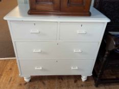 Painted pine chest of two short above two long drawers on turned legs, 84cm by 87cm by 46cm.