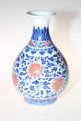 Large Chinese ovoid vase decorated with red flowers on blue and white ground with six-character