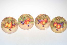 Set of four Royal Worcester fruit decorated 6" plates, each signed Freeman.