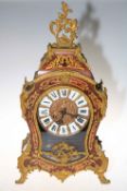 Ornate gilt metal French boule clock with decorative finial, 59cm high.
