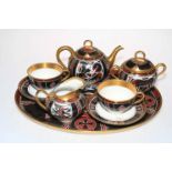 Limoges Cabaret eight piece tea for two service with Egyptian style decoration.
