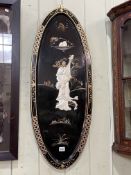 Pair oval Oriental lacquered panels with applied figure decoration, 91.5cm by 36cm.