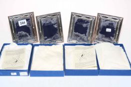 Set of four hallmarked sterling silver photograph frames, boxed.