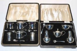 Cased eight piece silver condiment set, Birmingham 1935 and cased ten piece silver condiment set,