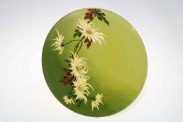 Burmantofts Faience wall plaque with barbotine floral decoration shaded green ground, 36cm diameter.